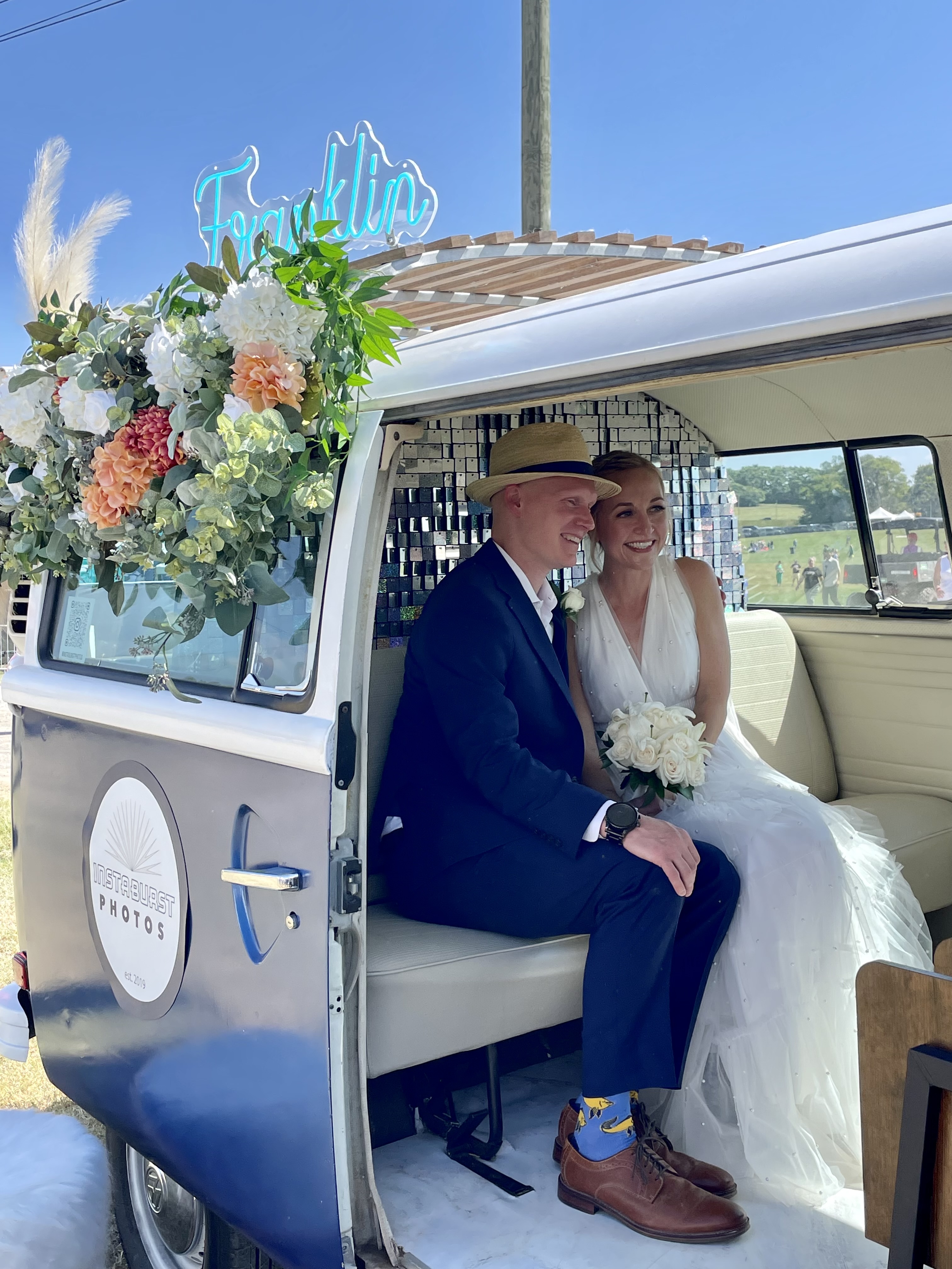 A wedding couple in the InstaBurst vintage bus